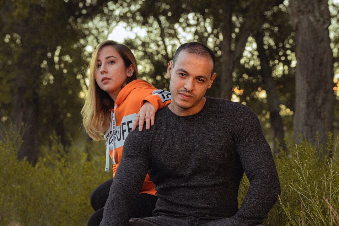 Two people practicing active listening while sitting outdoors