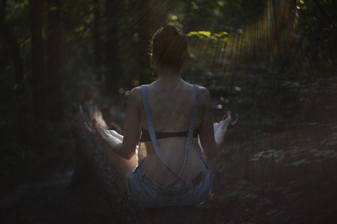 person meditating in nature