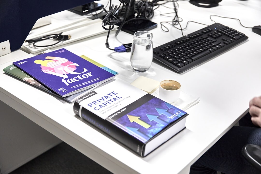 person reading book at desk