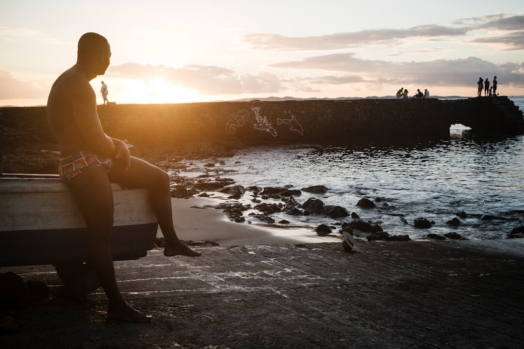 Brazilian man looking up confidently in golden hour light