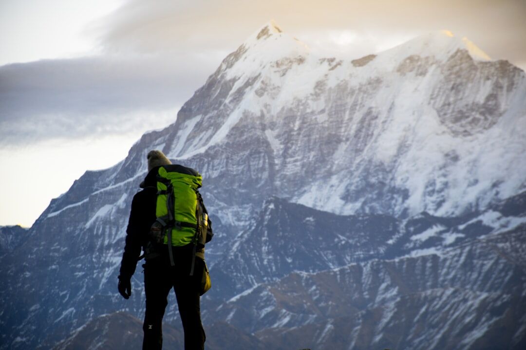 person climbing mountain