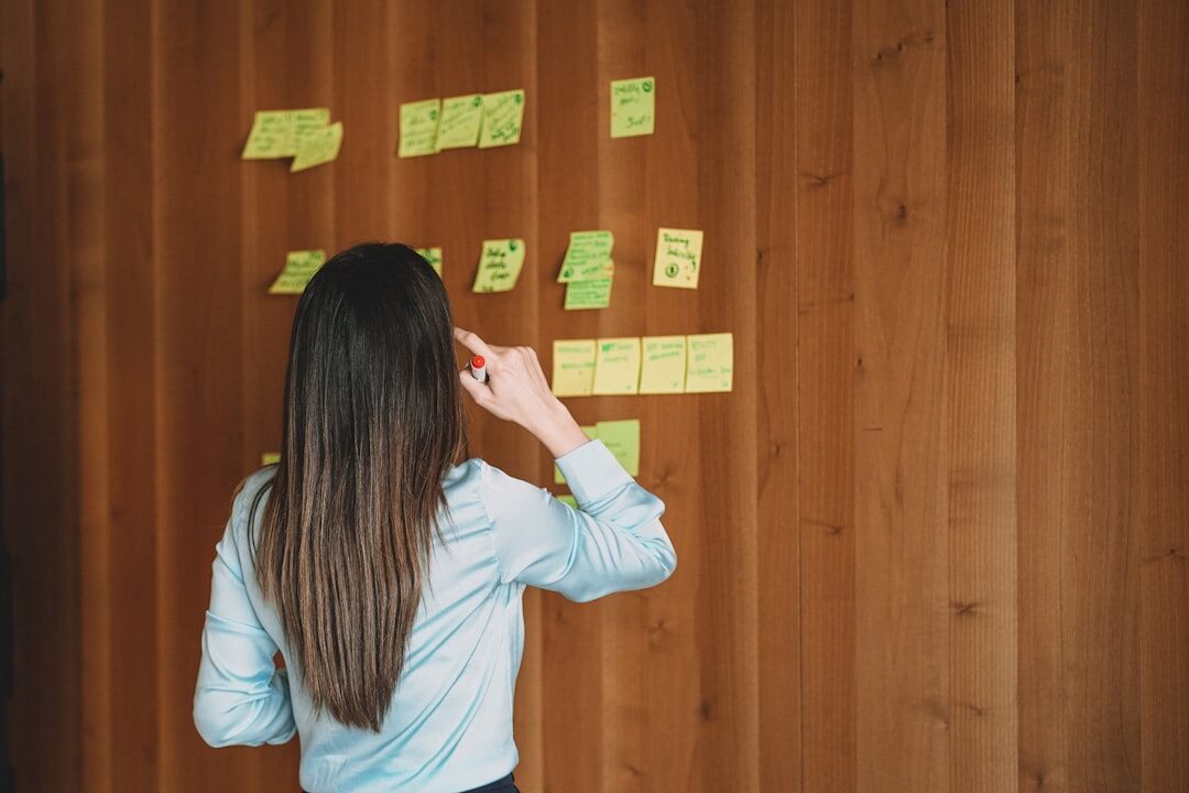 Group brainstorming session with sticky notes on a wall
